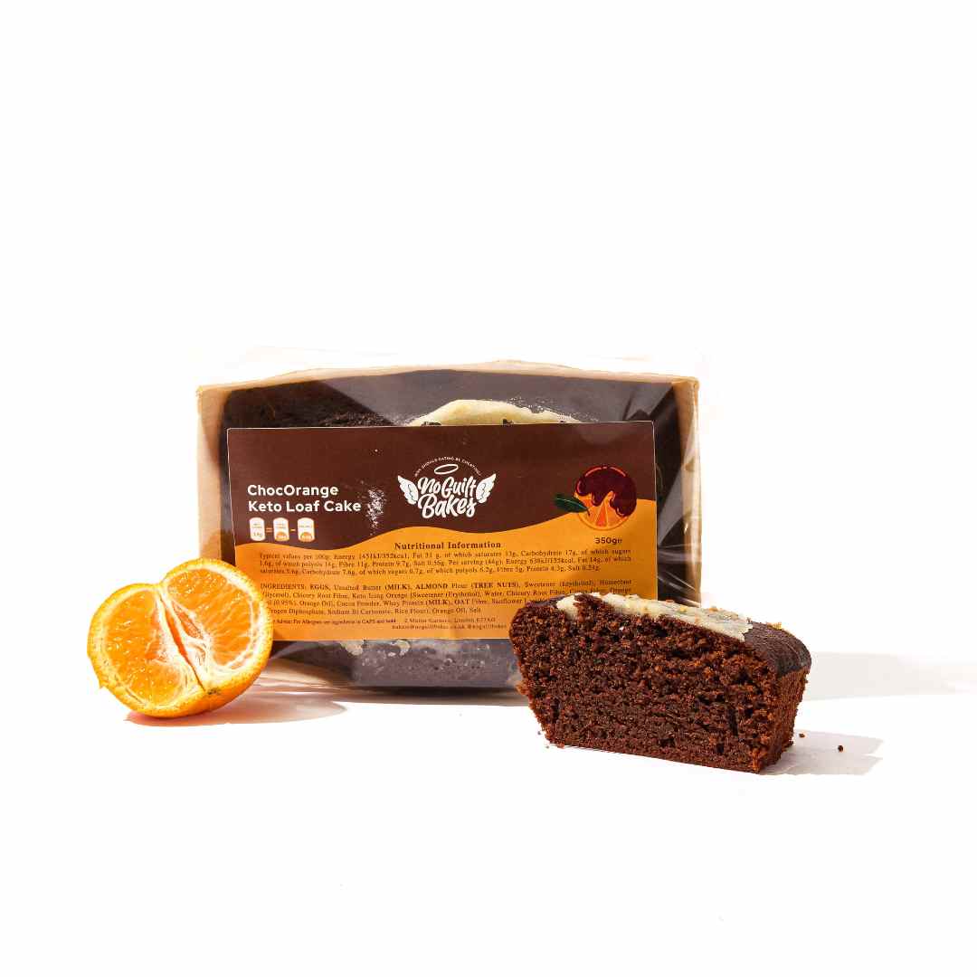 A gluten-free Chocolate Orange Loaf Cake from No Guilt Bakes, with slices of fresh oranges accompanying it.