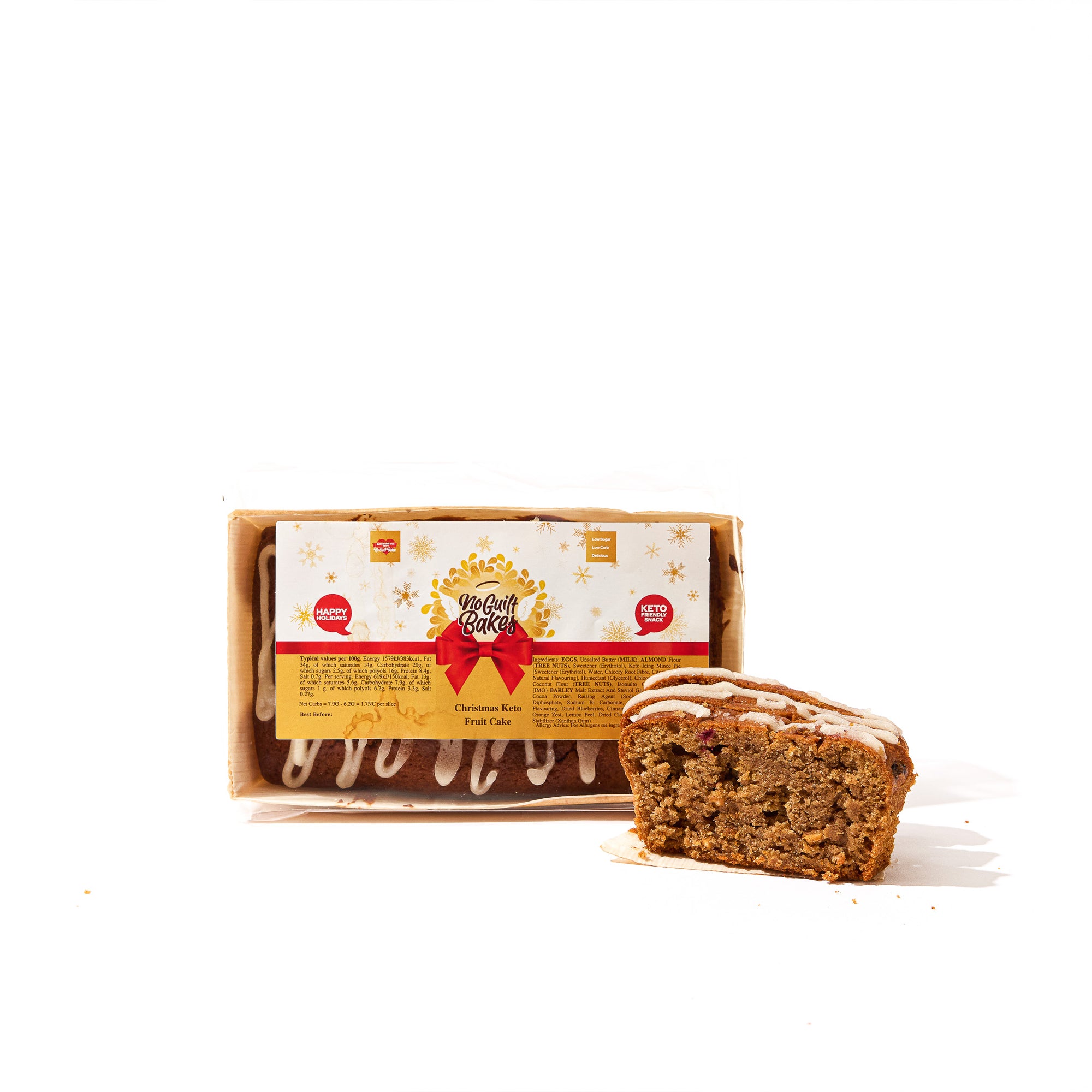 A piece of Low Carb Fruit Loaf Cake - Gluten Free, a popular Christmas treat by No Guilt Bakes, is sitting next to a box.